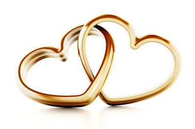 Gold heart shaped rings attached to each other. 3D illustration